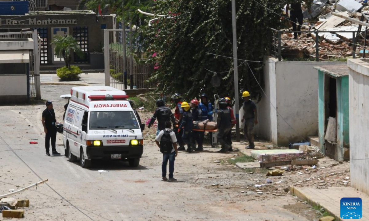 Rescue workers transfer injured people in La Guaira State, Venezuela, June 25, 2026. Two powerful earthquakes, both exceeding magnitude 7, jolted Venezuela late Wednesday. Venezuela's acting President Delcy Rodriguez said the coastal state of La Guaira in northern Venezuela was the hardest hit, describing it as a 