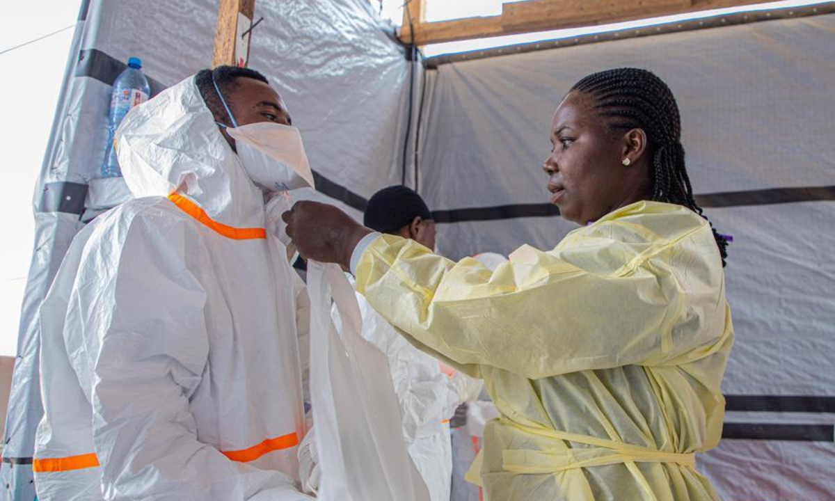 Medical workers put on protective suits at an Ebola treatment center in Bunia, Ituri Province, the Democratic Republic of the Congo, July 6, 2026. (Xinhua)