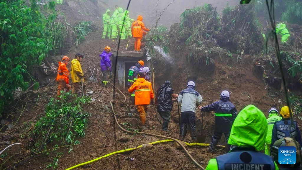 Rescuers conduct search and rescue operations at the site of a landslide in Baguio City, the Philippines, Aug. 10, 2026.
Four people were killed and six others missing after a landslide buried three houses in Baguio City in northern Philippines, local media reported on Monday.
The landslide struck at around 7 p.m. local time Sunday in Riverside, Barangay Guisad Surong, Baguio City, burying 13 people. As of Monday morning, seven had been pulled from the debris, according to the police. (Baguio Public Information Office/Handout via Xinhua)