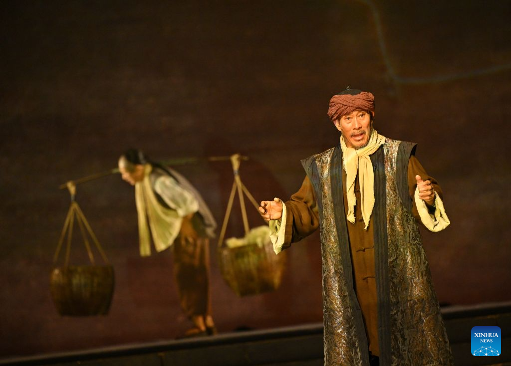 Actors perform a play during the seventh ethnic minority art festival in Beijing, capital of China, Aug. 18, 2026. The festival is held in Beijing from Aug. 18 to Sept. 23. (Xinhua/Han Xu)