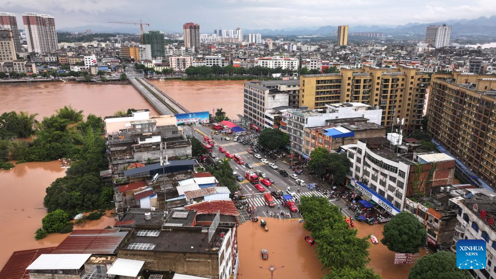 Rescuers transfer stranded residents in Ningming County, south China's Guangxi Zhuang Autonomous Region, Aug. 23, 2026. For days, Ningming County has been battered by typhoon-triggered heavy rainfall. Response forces have pooled their efforts to urgently evacuate stranded residents. (Xinhua/Zhou Hua)