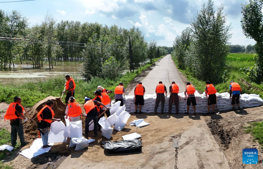 A drone photo taken on Aug. 6, 2026 shows villagers stacking sandbags for flood prevention in Hongqi Village of Lanxi County, Suihua City, northeast China's Heilongjiang Province. Flood prevention measures have been implemented across northeast China's Heilongjiang Province, which has entered its main flood season.

China has earmarked 50 million yuan (about 7.36 million U.S. dollars) in central government funds to support post-disaster recovery in flood-hit Heilongjiang Province in the northeast, the National Development and Reform Commission (NDRC) said Tuesday. (Photo by Lu Feng/Xinhua)