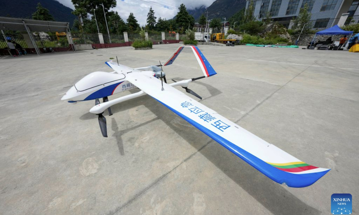 A high-altitude medium-sized composite-wing drone is seen in Gyirong Town, southwest China's Xizang Autonomous Region, Aug. 31, 2026. The local emergency management department in Xizang Autonomous Region has dispatched a drone detection team to carry out disaster assessment missions. The medium-sized composite-wing drone has monitored the conditions of the barrier lake and the mountain terrain in the area affected by the mudslide, providing critical information to support search and rescue operations. (Xinhua/Jigme Dorje)