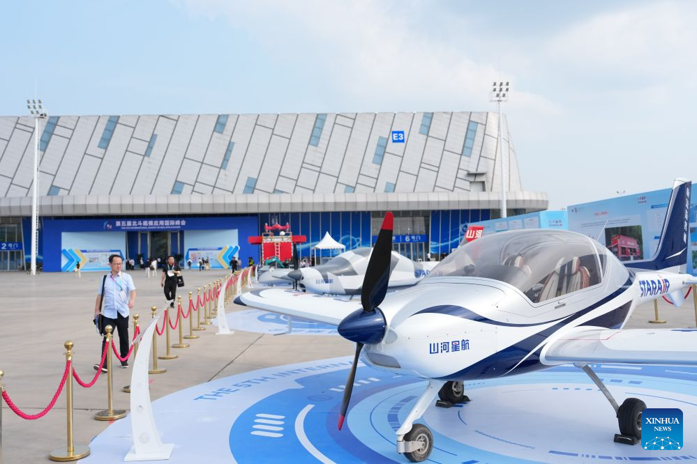People visit the outdoor exhibition area of the 5th International Summit on BeiDou Navigation Satellite System (BDS) Applications in Zhuzhou, central China's Hunan Province, Sept. 15, 2026. The 5th International Summit on BDS Applications kicked off in Zhuzhou on Tuesday, attracting about 900 domestic and international experts, scholars, business leaders, government officials, and representatives of international organizations to its opening ceremony. (Xinhua/Chen Zhenhai)