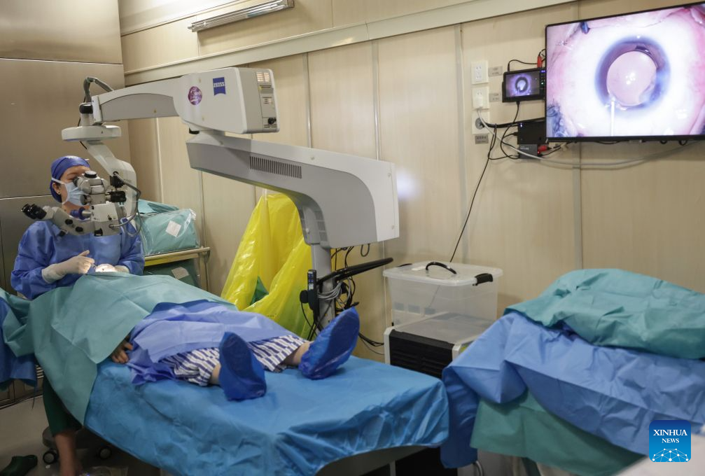 A doctor operates a cataract surgery for a patient on a train hospital in Hohhot, north China's Inner Mongolia Autonomous Region, Sept. 2, 2026. In recent days, a charity project offering free cataract surgeries for low-income patients is carried out in Hohhot. Arriving in Hohhot on July 5, the train hospital started offering diagnoses on July 17, and will be providing services for three months. So far, it has completed over 700 surgeries and is expected to complete 1,200 surgeries by the end of its service in Hohhot. (Xinhua/Zhang Yuwei)