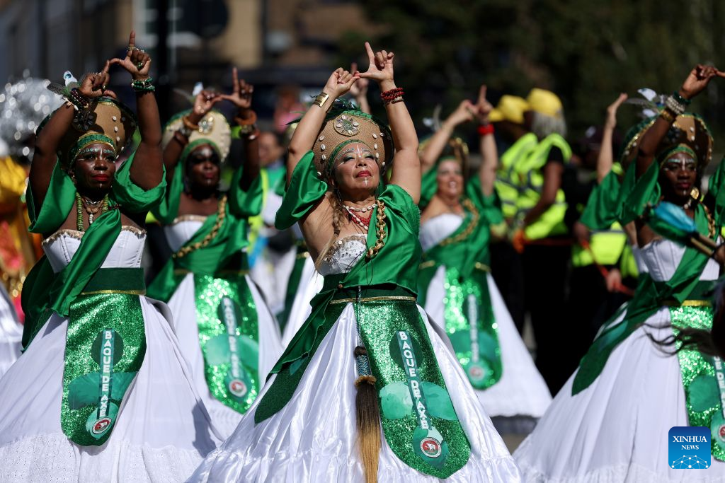 Performers participate in the Notting Hill Carnival in London, Britain, on Aug. 31, 2026. Originating in the 1960s, the carnival is a way for Afro-Caribbean communities to celebrate their cultures and traditions. (Xinhua/Li Ying)