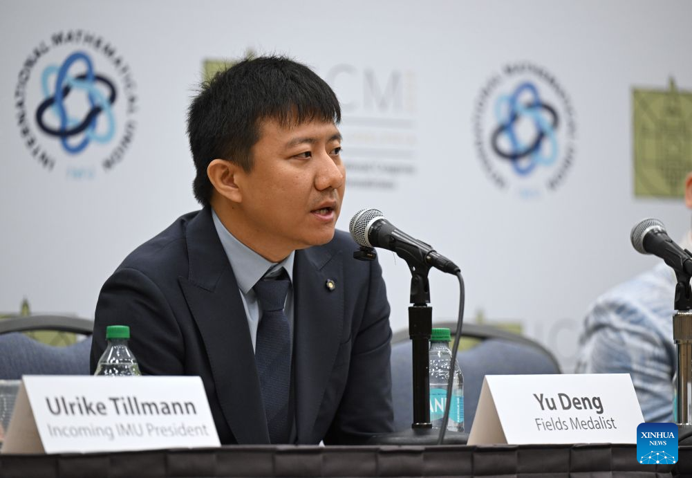Chinese mathematician Deng Yu attends a press conference after the opening ceremony of the 2026 International Congress of Mathematicians in Philadelphia, the United States, July 23, 2026. Chinese mathematicians Deng Yu and Wang Hong were awarded the Fields Medals at the opening ceremony of the 2026 International Congress of Mathematicians held here on Thursday, marking the first time Chinese mathematicians have won the prestigious honor. The other recipients of the 2026 Fields Medals are American John Pardon and Canada's Jacob Tsimerman. (Xinhua/Li Rui)