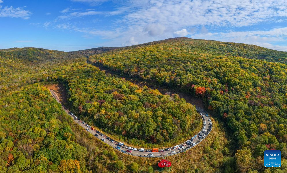 An aerial drone photo taken on Sept. 27, 2026 shows a view of Yichun City, northeast China's Heilongjiang Province. In autumn, Heilongjiang Province is filled with vibrant colors. Mountains, forests and waters form a picturesque landscape, showcasing the beauty of autumn in northeastern China. (Photo by Li Jiaxing/Xinhua)