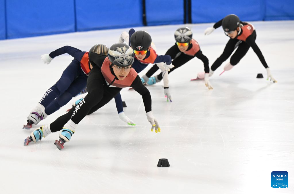 Children practice skating at an ice rink in Shijiazhuang, north China's Hebei Province, July 21, 2026. The city of Shijiazhuang has been focusing on developing its ice-and-snow economy during summers in recent years. A number of indoor ski resorts across the city have rolled out consumption subsidies and hosted professional competitions to develop a heat-relief business model. (Photo by Chen Qibao/Xinhua)