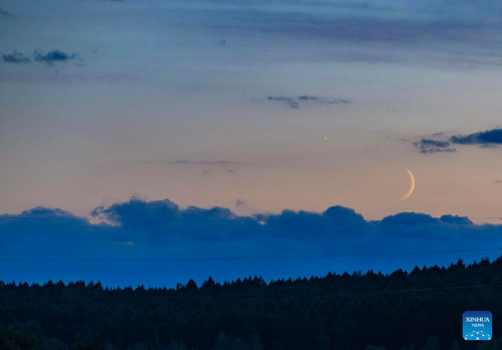This photo taken on Sept. 14, 2026 shows the planet of Venus next to the moon in the sky over Jiayin County, northeast China's Heilongjiang Province. (Photo by Li Shaojun/Xinhua)