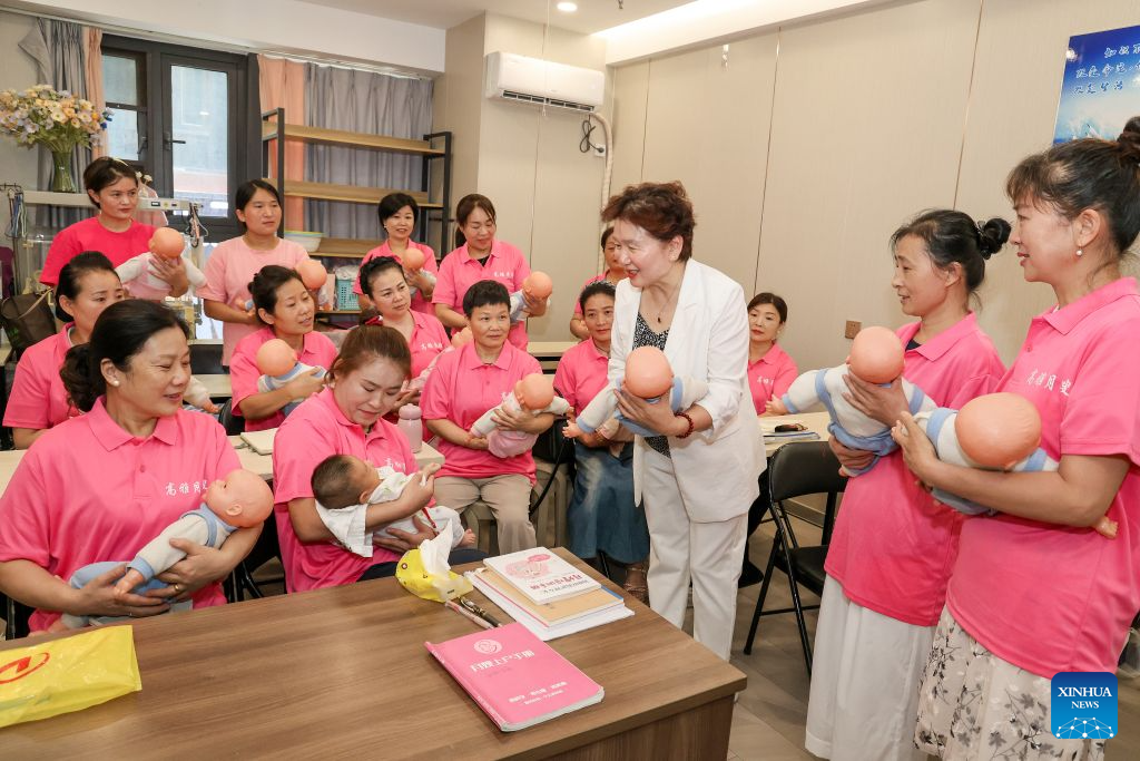 A trainer gives a lecture to postpartum caregivers at a training center of domestic services in Tengzhou City, east China's Shandong Province, July 21, 2026. A number of domestic services brands have emerged in Shandong in recent years, offering widely ranging services such as eldercare, maternity care, and in-home caregiving. (Photo by Song Haicun/Xinhua)