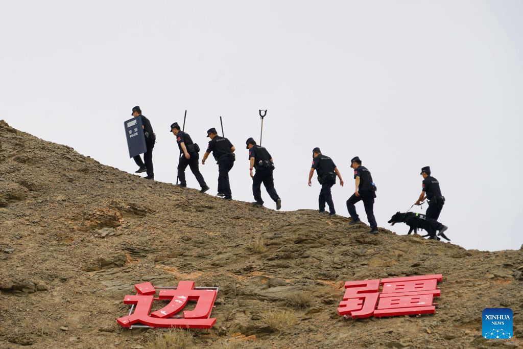 Li Junjie (2nd R) and colleagues patrol along the China-Mongolia border in Mazongshan Town of northwest China's Gansu Province, July 15, 2026. (Photo by Ma Xiaowei/Xinhua)