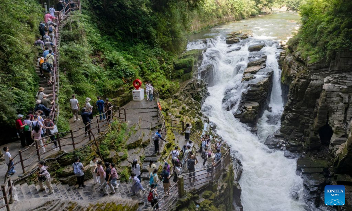 Tourists visit a scenic spot for summer retreat in Lichuan City, Enshi Tujia and Miao Autonomous Prefecture, central China's Hubei Province, July 26, 2026. (Photo by Zheng Gaofeng/Xinhua)