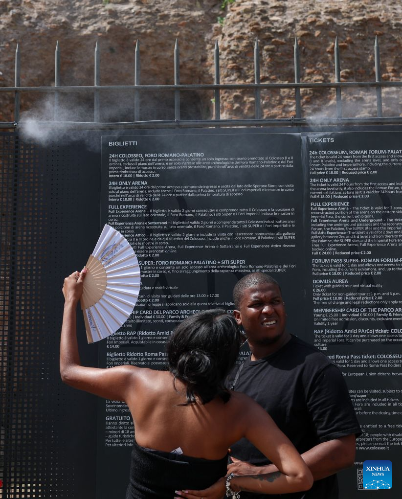 Tourists wait to enter the Roman Forum as overhead misting fans spray cool water vapour during a heatwave in Rome, Italy, Aug. 26, 2026. (Xinhua/Wang Kaiyan)