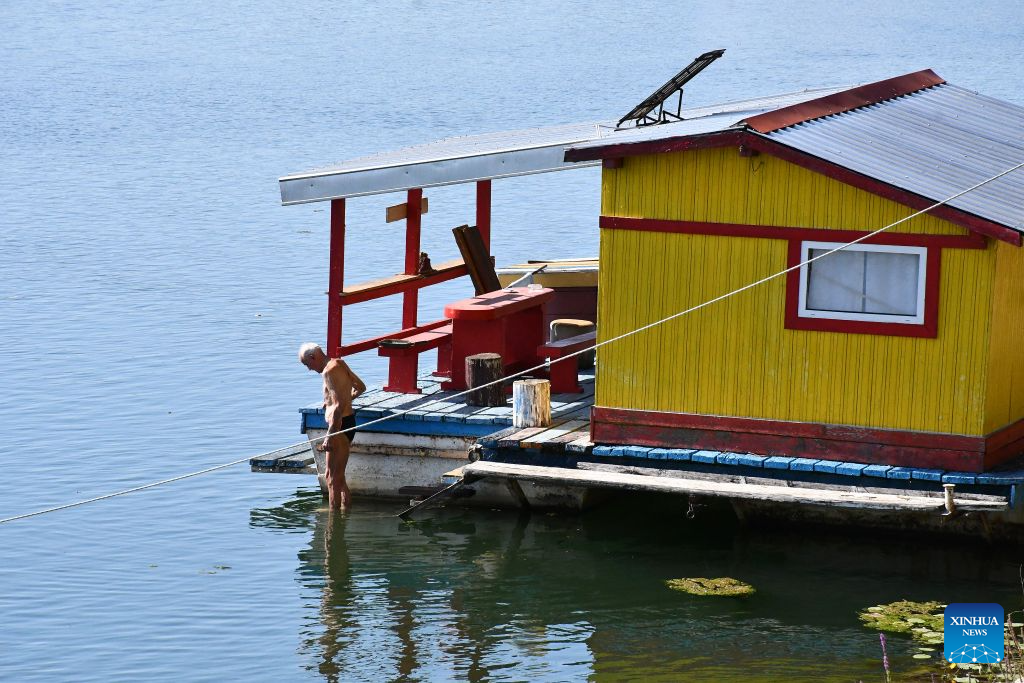 This photo taken on Aug. 4, 2026 shows a house in Splavarska Street in Slavonski Brod, Croatia. Splavarska Street is unique in the country as its residents live on the water of Sava River, in houseboats with their own official addresses and house numbers. (Ivica Galovic/PIXSELL via Xinhua)