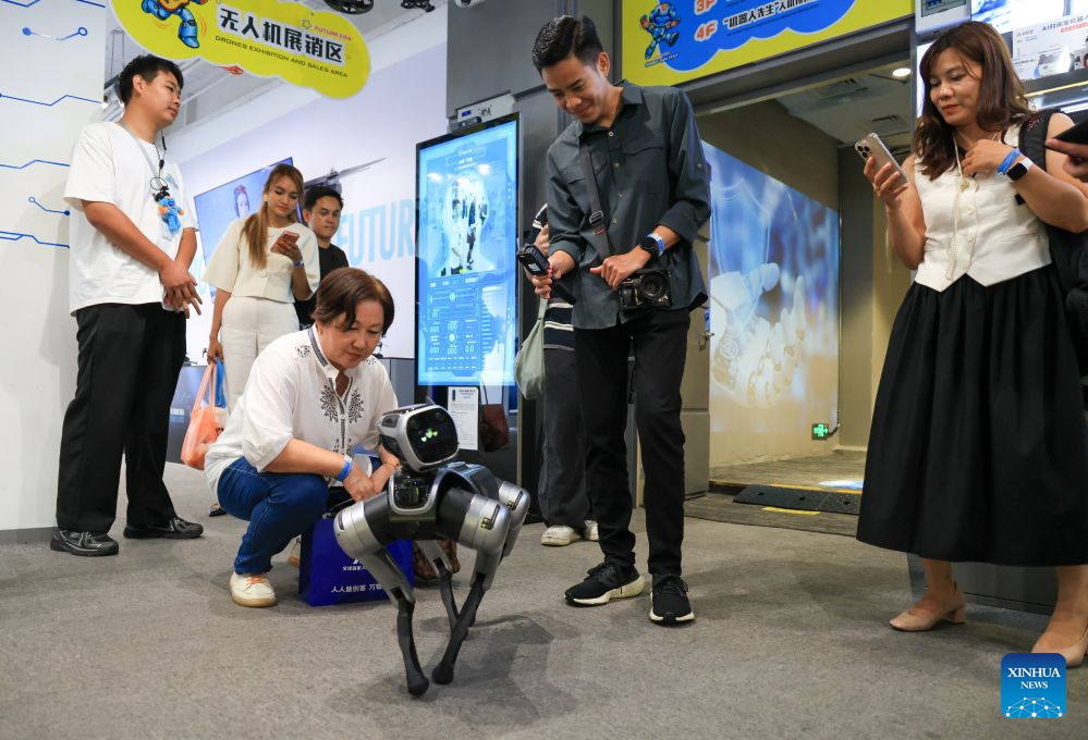 Journalists and social media influencers from ASEAN countries interact with a robotic dog at a robotics zone in Shenzhen, south China's Guangdong Province, July 29, 2026. Over 20 journalists and social media influencers from ASEAN countries visited Shenzhen on Wednesday.
This year marks the fifth anniversary of the establishment of the China-ASEAN Comprehensive Strategic Partnership. (Xinhua/Mao Siqian)