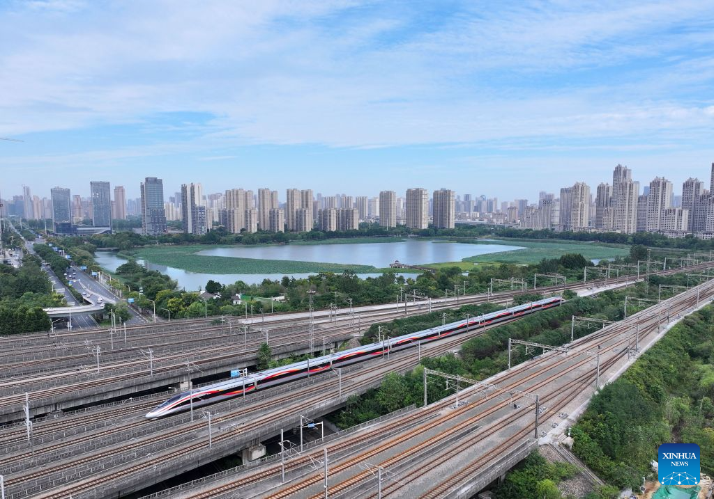 A drone photo shows a bullet train running in Wuhan City, central China's Hubei Province, Aug. 31, 2026. The 62-day summer travel rush officially concluded on Monday. (Photo by Zhao Jun/Xinhua)