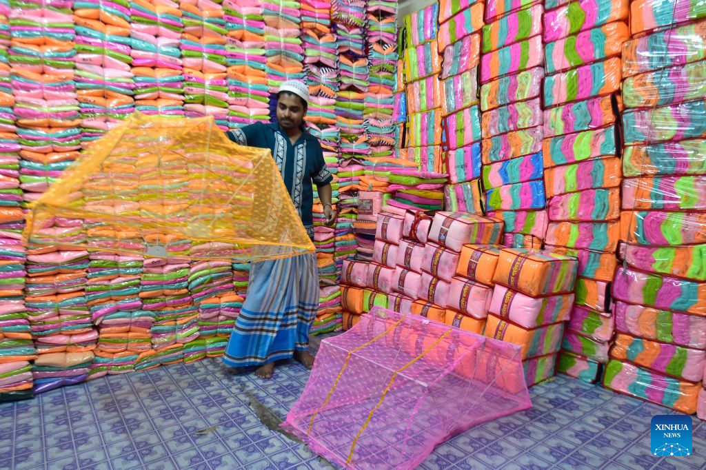 A seller works at a wholesale market for mosquito nets in Narayanganj, Bangladesh, on Sept. 14, 2026. Bangladesh has seen a rising demand for mosquito nets and other protective products amid an ongoing dengue outbreak. (Photo by Habibur Rahman/Xinhua)