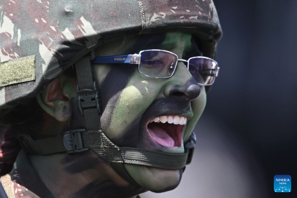 A female army soldier performs during the Soldier's Day ceremony in Brasilia, Brazil, on August 25, 2026. (Photo by Lucio Tavora/Xinhua)