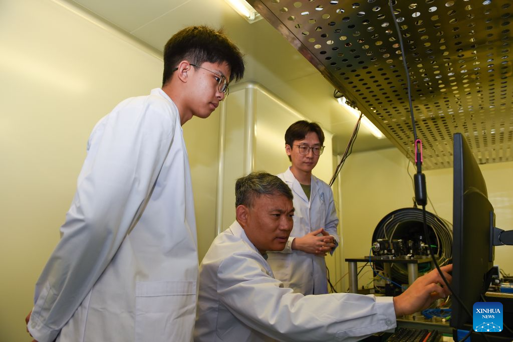 Professor Wang Yanzhang (C) discusses with doctoral students at a laboratory of Jilin University in Changchun, northeast China's Jilin Province, Sept. 8, 2026. Professor Wang Yanzhang, the executive deputy director of the State Key Laboratory of Deep Earth Exploration and Imaging at Jilin University, and his team have been deeply engaged in the field of deep Earth exploration for over a decade.

The team has developed an integrated exploration system combining airborne electromagnetic surveying with SERF magnetometry. Their self-developed helicopter-borne electromagnetic equipment acts like a CT scanner for the Earth, revealing underground geological structures, while SERF magnetometers detect minute variations in the Earth's magnetic field. Together, the technologies make underground rock formations, mineral resources and geological hazards measurable and visible.

Since 2021, the team has conducted airborne exploration in various areas of Xinjiang Uygur Autonomous Region and Qinghai Province, acquiring subsurface geological information by penetrating ground surface to depths of over one kilometer. The technological advances have significantly enhanced the efficiency, depth and precision of deep resource exploration in China. (Xinhua/Zhang Nan)
