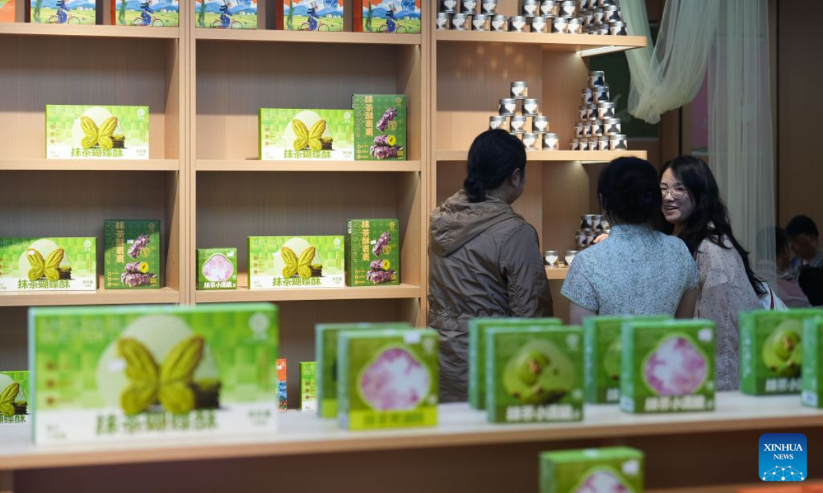 Tourists buy matcha products at a store in Jiangkou County, Tongren City, southwest China's Guizhou Province, May 29, 2026. (Photo by Shen Yikai/Xinhua)