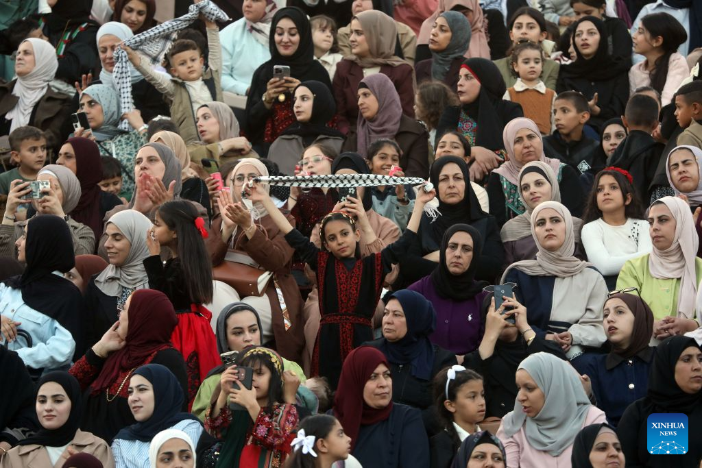 Palestinians attend a mass wedding ceremony in Dura near the West Bank city of Hebron, on Sept. 26, 2026. The mass wedding ceremony brought together 88 Palestinian grooms and brides, with thousands of local residents attending the event. (Photo by Mamoun Wazwaz/Xinhua)