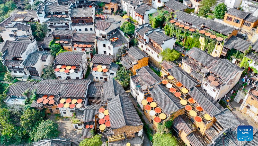 An aerial drone photo taken on Sept. 15, 2026 shows a view of Huangling Village of Wuyuan County, east China's Jiangxi Province. In autumn, villagers are busy drying agricultural products in Wuyuan County, and the colorful scene attracts tourists. (Xinhua/Hu Chenhuan)