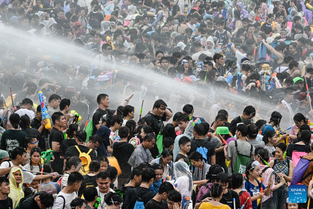 People attend a water festival held in Baoting Li and Miao Autonomous County, south China's Hainan Province, Aug. 19, 2026.
A water festival is held here on Wednesday, on the occasion of the Qixi Festival, the Chinese version of the Valentine's Day. (Xinhua/Pu Xiaoxu)