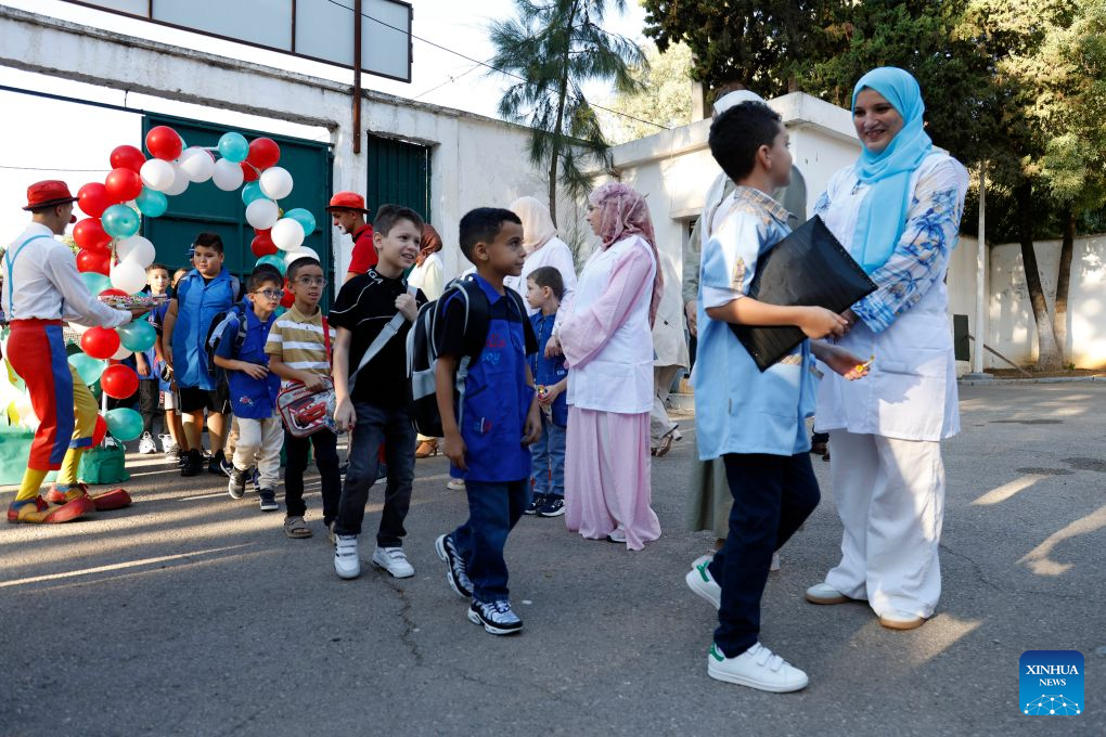 Students return to school in Algiers, Algeria, on Sept. 21, 2026. Nearly 12 million students in primary and middle schools across Algeria returned to school on Monday. (Photo by Billel Bensalem/Xinhua)