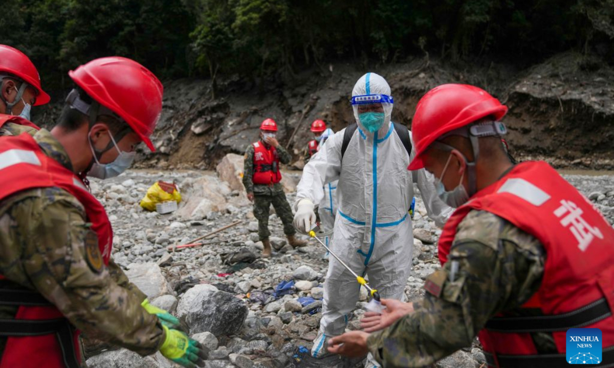 A worker conducts disinfection for rescuers at the mudslide-hit area in Gyirong County, southwest China's Xizang Autonomous Region, Aug. 30, 2026. Disinfection operations were carried out after a devastating mudslide, triggered by an ice-rock avalanche in Nepal, hit the border port of Gyirong in southwest China's Xizang Autonomous Region. (Xinhua/Jigme Dorje)