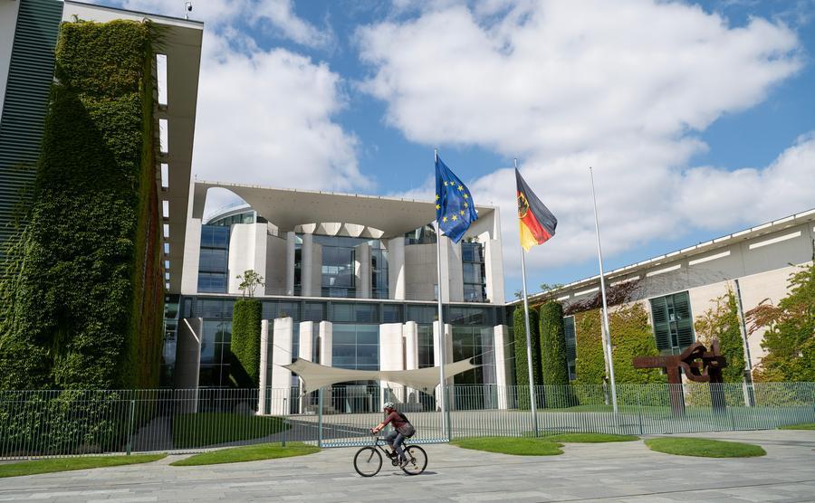 A woman rides past the German Chancellery in Berlin, Germany, July 24, 2026.  (Xinhua/Zhang Haofu)