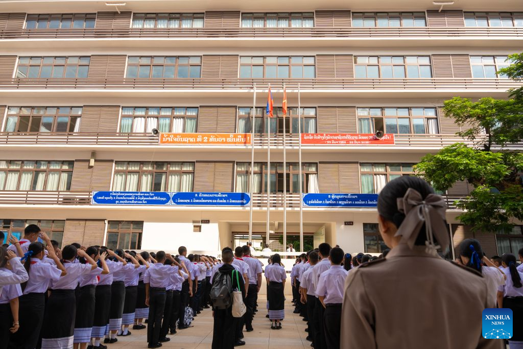 Teachers and students attend a ceremony marking the start of the new semester at a school in Vientiane, Laos, Sept. 1, 2026. (Photo by Kaikeo Saiyasane/Xinhua)