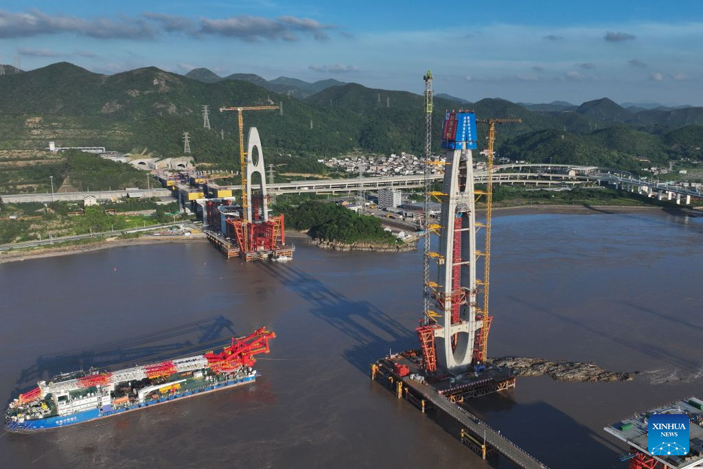 An aerial drone photo taken on Sept. 12, 2026 shows the construction site of the No. 20 main tower of Fuchimen road-rail bridge along Ningbo-Zhoushan Railway in Zhoushan, east China's Zhejiang Province. The main tower, constructed by the China Railway Major Bridge Engineering Group Co., Ltd., was successfully topped out on Sunday, marking the completion of the construction of all six main towers of the three cross-sea bridges of the Ningbo-Zhoushan Railway.

The main line of the Ningbo-Zhoushan Railway is 76.4 kilometers long, starting from Ningbo East Railway Station in the west and ending at Zhoushan Island in the east, with a designed speed of 250 kilometers per hour. (Xinhua/Huang Zongzhi)