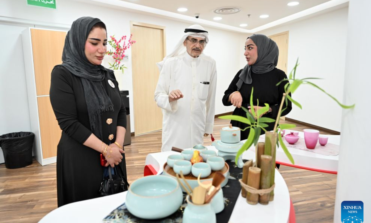People participate in the Chinese & Kuwaiti Tea Art and Treats Tasting event at the China Cultural Center in Kuwait in Hawalli Governorate, Kuwait, Aug. 23, 2026. (Photo by Asad/Xinhua)