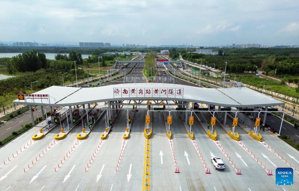 An aerial drone photo taken on Aug. 25, 2026 shows vehicles entering a tunnel across the Yellow River in Jinan, east China's Shandong Province. A new tunnel across the Yellow River, China's second-longest river, opened to traffic on Tuesday in Jinan.
Stretching about 5.75 kilometers in total, the tunnel under Huanggang Road features a shield-driven section of roughly 3.3 kilometers, bored by the Shanhe shield tunneling machine with a cutting diameter of 17.5 meters, the largest of its kind among underwater shield tunnels in the country. (Xinhua/Zhu Zheng)