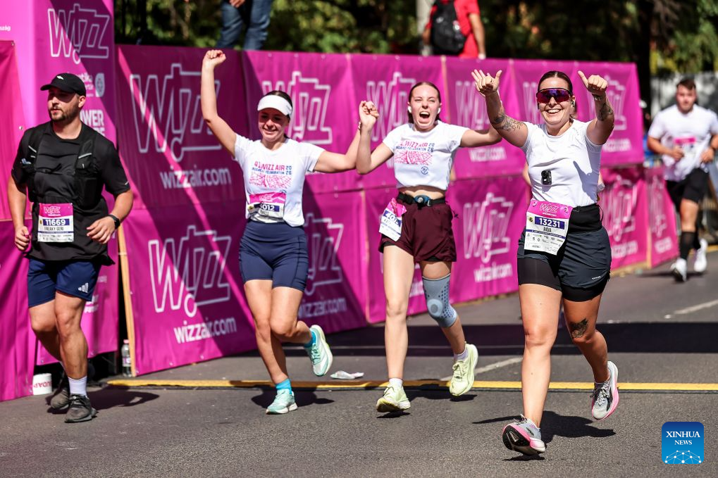 Runners cross the finish line in the 41st Wizz Air Budapest Half Marathon in Budapest, Hungary, Sept. 6, 2026. (Photo by David Balogh/Xinhua)