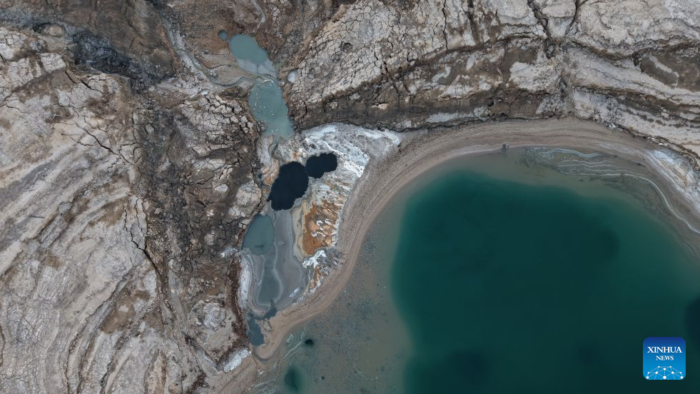 An aerial drone photo taken on Aug. 24, 2026 shows a view of the Dead Sea and sinkholes near Ein Gedi beach of Israel. (Photo by Gil Cohen Magen/Xinhua)