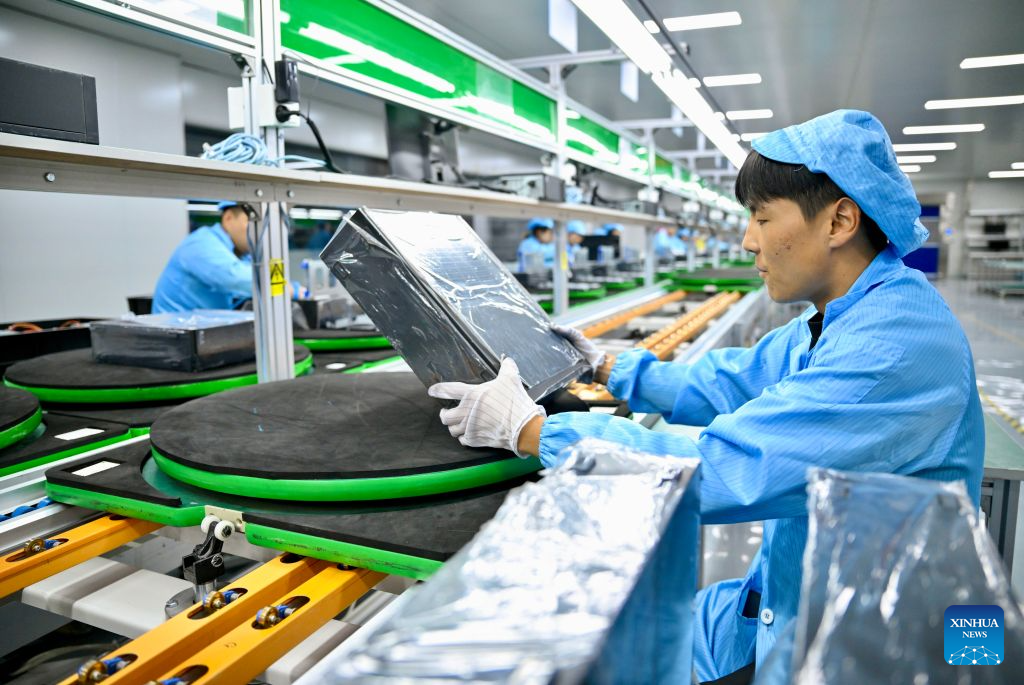 A worker assembles computers at an intelligent workshop in Minning Town, Yongning County of Yinchuan, northwest China's Ningxia Hui Autonomous Region, Sept. 11, 2026.(Xinhua/Yang Zhisen)