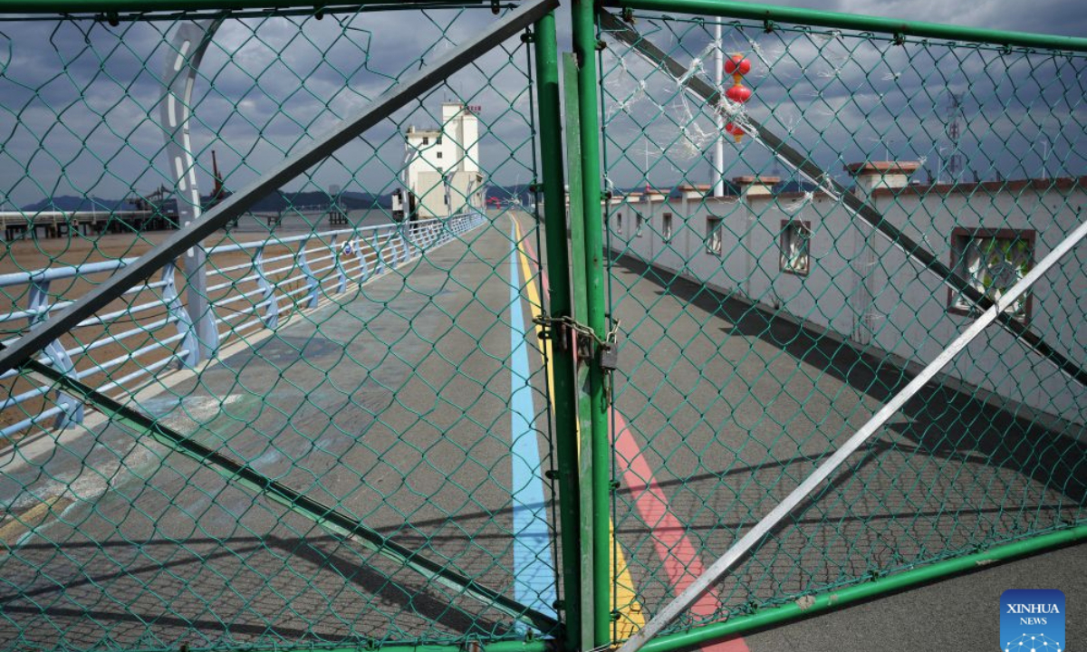 This photo taken on Aug. 27, 2026 shows a locked gate at a fishing wharf in Yueqing City, east China's Zhejiang Province. East China's Zhejiang Province raised its typhoon emergency response to Level I, the highest level, at 8 p.m. Thursday as Typhoon Saudel, the 18th typhoon of this year, is forecast to make landfall in the province. (Xinhua/Han Chuanhao)