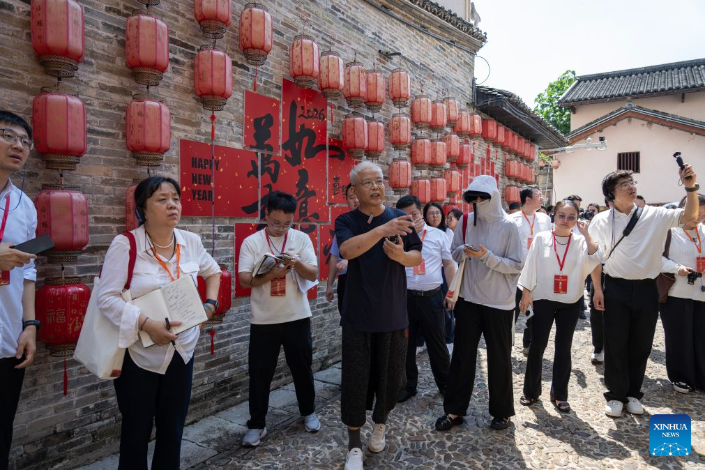 Journalists visit an ancient street scenic area in Yudu County, east China's Jiangxi Province, Sept. 8, 2026. This year marks the 90th anniversary of the victory of the Long March by the Red Army under the leadership of the Communist Party of China (CPC). As the starting point of the Long March by the Central Red Army, Yudu County has leveraged its abundant red-themed tourism resources to diversify tourism experiences, promoting both the inheritance of the Long March spirit and the development of local tourism. (Xinhua/Cao Mengyao)