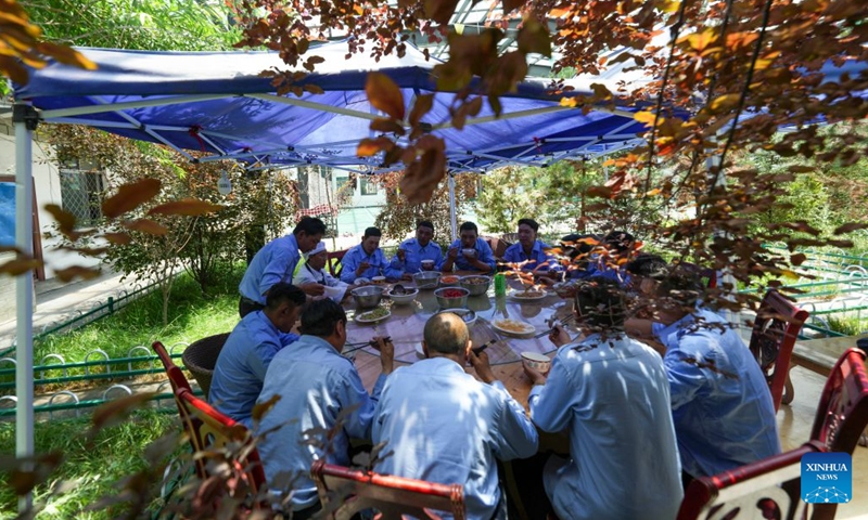 Members of a railway protection team have lunch at their barrack in Seni District of Nagqu, southwest China's Xizang Autonomous Region, June 18, 2026. Since the Qinghai-Xizang Railway became fully operational in 2006, a railway protection team has stationed in Nagqu, the city with the highest altitude in China. They are in charge of a 25-kilometer section of track, with duties of identifying potential hazards, preventing people and livestock from entering the railway, and taking part in rescue operations following accidents along the line. (Photo: Xinhua)