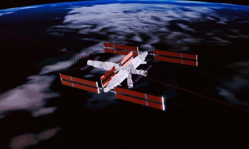 This simulated image captured at Beijing Aerospace Control Center on May 25, 2026 shows the Shenzhou-23 crewed spaceship docking with the radial port of Tiangong's core module Tianhe. (Xinhua/Jin Liwang)