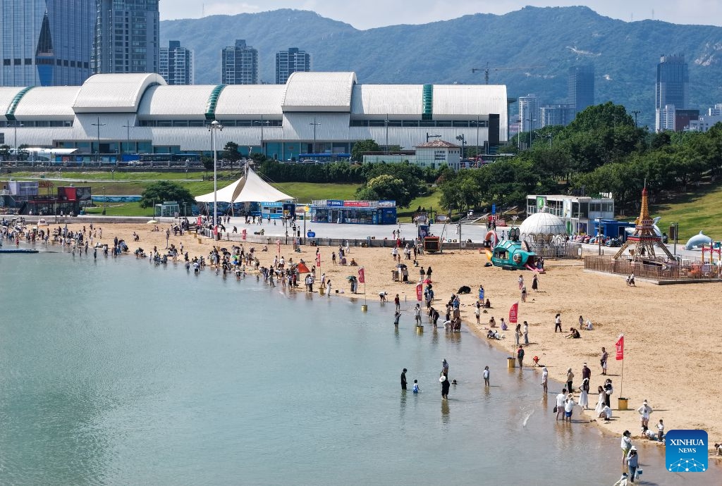 An aerial drone photo taken on June 20, 2026 shows people visiting a seaside park in Lianyungang, east China's Jiangsu Province. (Photo: Xinhua)