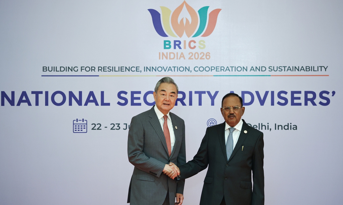 Chinese Foreign Minister Wang Yi shakes hands with Indian National Security Advisor Ajit Doval during a welcome ceremony as part of the 16th Meeting of BRICS National Security Advisors and High Representatives on National Security in New Delhi, India, on June 23, 2026. Photo: VCG