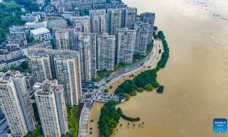 An aerial drone photo taken on June 22, 2026 shows the flood peak passing through the Liujiang River in Liuzhou, south China's Guangxi Zhuang Autonomous Region. Due to heavy rainfall, the Liuzhou hydrological station on the Liujiang River recorded the first flood peak of 2026 on Monday, with the highest water level reaching 85.64 meters, exceeding the alert line by 3.14 meters while flooding some riverfront roads. (Photo: Xinhua)