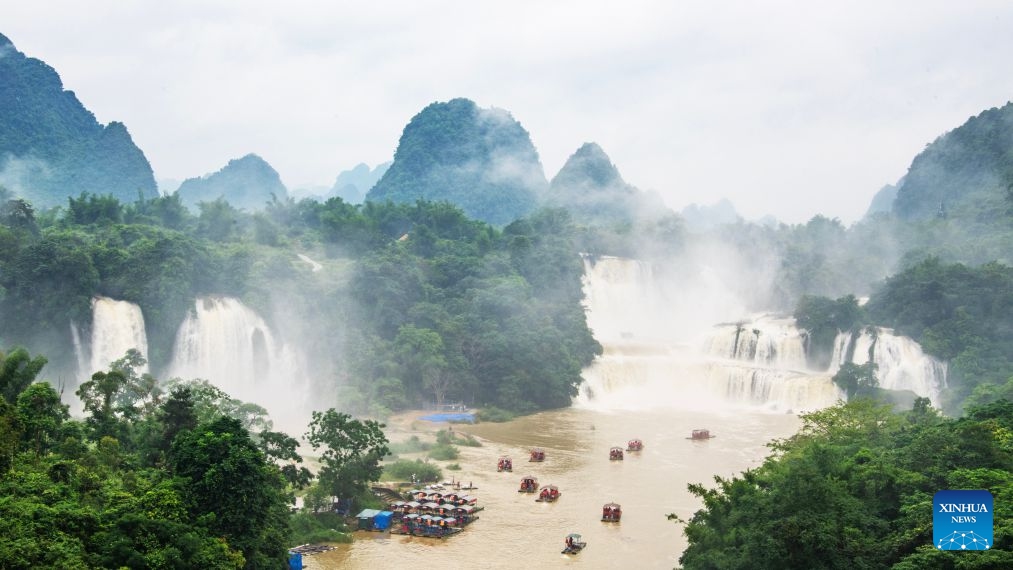 Tourists take rafts for sightseeing in Daxin County of Chongzuo City, south China's Guangxi Zhuang Autonomous Region, June 20, 2026. People enjoyed the three-day holiday of the Dragon Boat Festival, also called Duanwu Festival, which falls on June 19 this year, via various activities across the country. (Photo: Xinhua)