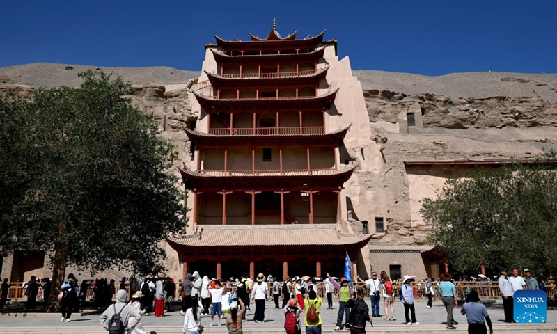 Tourists visit the Mogao Grottoes in Dunhuang, northwest China's Gansu Province, June 21, 2026. (Photo: Xinhua)