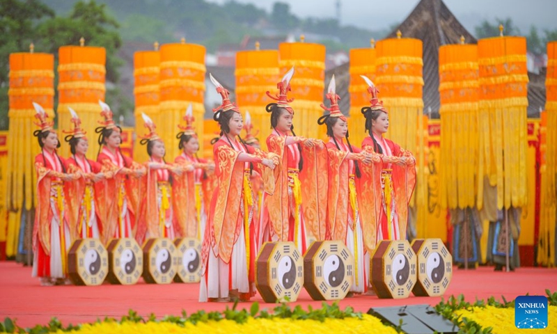 Participants stage a music-and-dance ritual during a ceremony worshiping Fuxi, a mythical ancestor of the Chinese nation, in Tianshui, northwest China's Gansu Province, June 21, 2026. Tianshui is known as the birthplace of the mythical figure, who is worshiped for his contribution to teaching people about fishing, hunting and animal husbandry. According to historical records, the annual commemoration of Fuxi has a history of more than 2,000 years. It was listed as a form of national intangible cultural heritage in 2006. (Photo: Xinhua)
