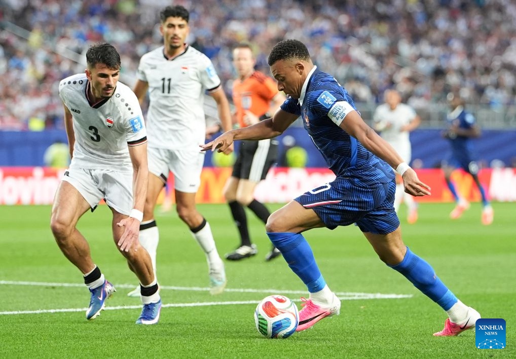 Kylian Mbappe (R) of France vies with Hussein Ali (L) of Iraq during the group I match between France and Iraq at the 2026 FIFA World Cup at Philadelphia Stadium in Philadelphia, the United States, June 22, 2026. (Photo: Xinhua)
