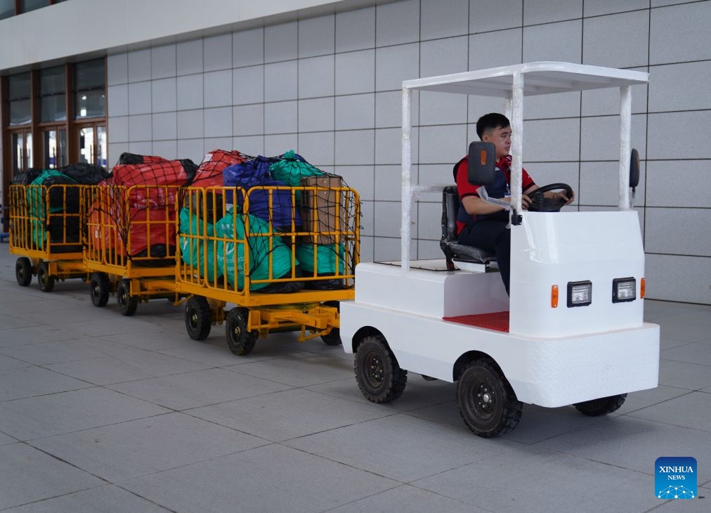 A worker drives a vehicle on the platform of Vientiane Station of the China-Laos Railway to transport baggage and parcels in Vientiane, Laos, June 22, 2026. (Photo: Xinhua)